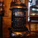 M-14 Round Oak Stove. Original small trademark finial. $2450.00