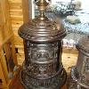 18'' Matchstrike with three matchstrike windows with the option of three mica windows. Cast Iron top ring. All original condition. The finial is an all original red two jeweled finial. $3250.00