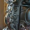 Ornate ILINOY heater with dragon sidewings, claw feet and decorative trim with detailed drafts. $3850.00