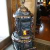 Ornate ILINOY heater with dragon sidewings, claw feet and decorative trim with detailed drafts. $3850.00