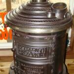 Original 1890 18'' Round Oak stove with a very rare Cherub Finial. $2450